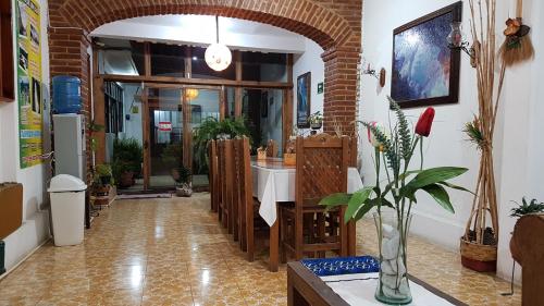 a bathroom with a sink and a mirror in a room at Hotel Posada El Gran Cipres in San Cristóbal de Las Casas