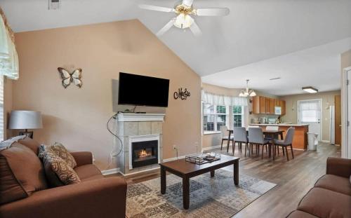 a living room with a couch and a fireplace at Best spot for you and the family in Sevier County in Pigeon Forge