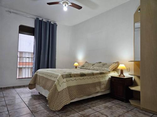 Llit o llits en una habitació de Apê Itararé em São Vicente/SP