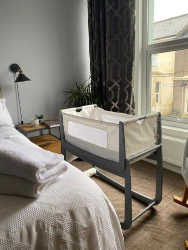 A bed or beds in a room at Specious City Victorian House