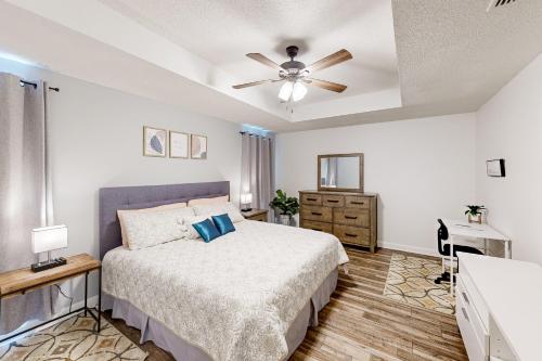 a bedroom with a bed and a ceiling fan at Amazon Riviera in Foley