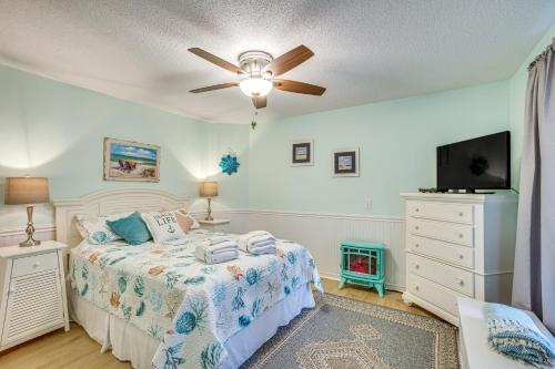 a bedroom with a bed and a ceiling fan at Saint Helena Island Condo - Steps to Beach! in Oceanmarsh Subdivision