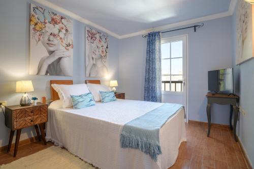 Een bed of bedden in een kamer bij Casa Fantástica