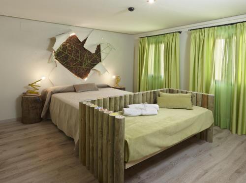 Tempat tidur dalam kamar di Hotel Galería Essentia