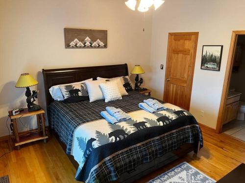 a bedroom with a bed with a wolf comforter at Paradise Peak - Tranquility and majestic splendor! in Butler