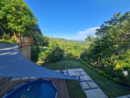 a tent on a deck with a view of a garden at Casa Margarita in First Bight