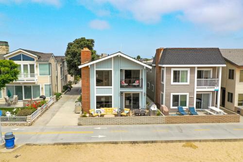 a house on a street with houses at 2 Bedroom Home on the Beach with Ocean View in Newport Beach