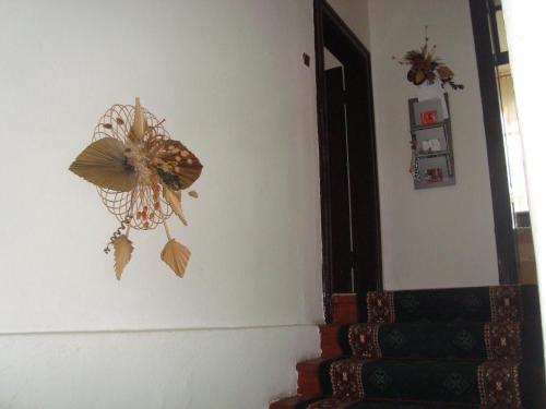 a room with a butterfly decoration on the wall at Penzion Adria in Turčianske Teplice