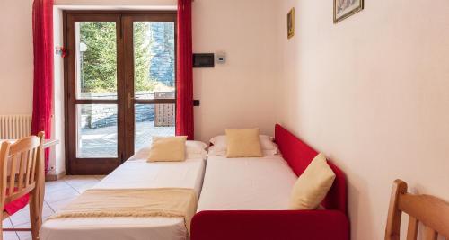 Ένα ή περισσότερα κρεβάτια σε δωμάτιο στο Lanterna Apartments