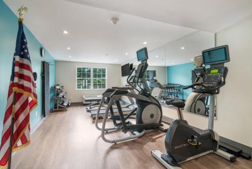 a gym with cardio equipment and an american flag at Holiday Inn Express - Plymouth by IHG in Plymouth