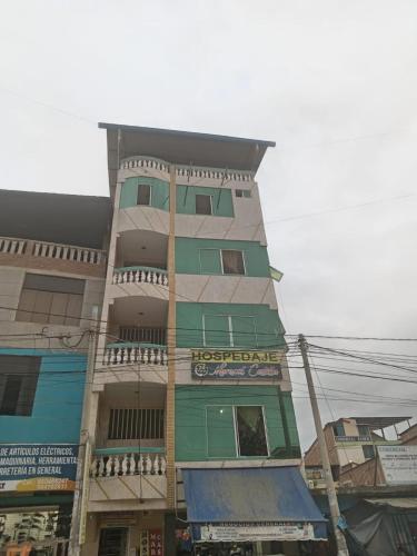 a tall building with green and white at HOSPEDAJE MARISCAL CASTILLA in Tumbes