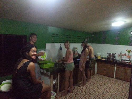 a group of people standing in a kitchen at Kama Siri Koh Kood in Ko Kood