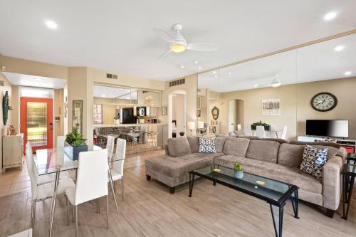 a living room with a couch and a table at Midnights at the Oasis in Cathedral City