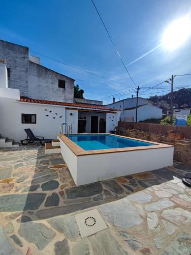 a swimming pool in the backyard of a house at Casa Tia Xica in Monsaraz