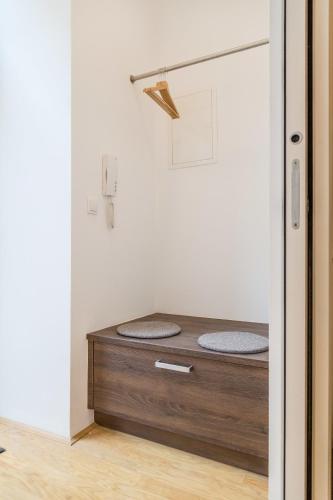 a room with a bed in the corner of a room at Vienna Stay Apartments Belvedere in Vienna