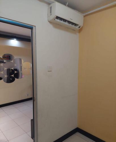 a room with a door and a wall with a window at Apartemen green bay pluit in Jakarta