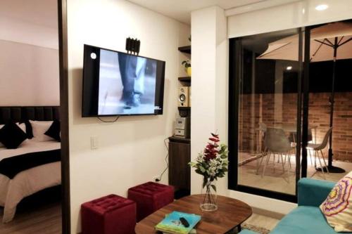 TV a/nebo společenská místnost v ubytování Apartamento moderno con balcón o terraza
