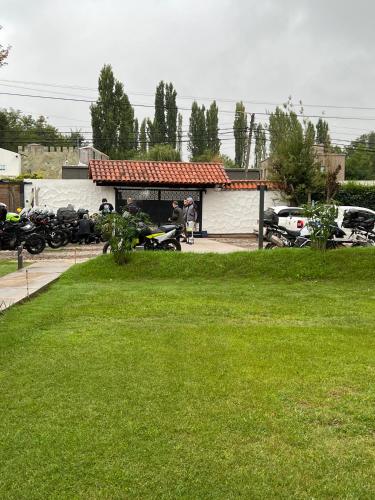 a building with a picnic table in a yard at Terra Campo Posada in Chacras de Coria