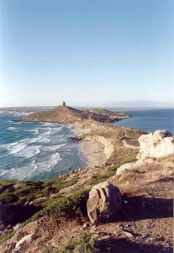an island in the ocean with a lighthouse on it at Casa Vacanze Margherita in Riola Sardo