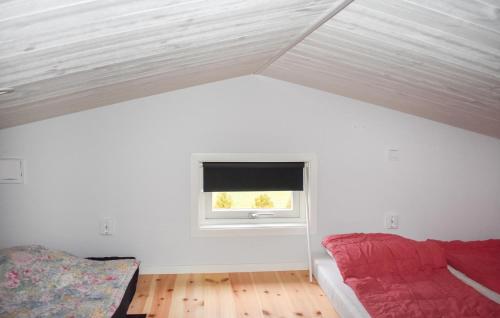 a room with a roof with a window and a couch at 1 Bedroom Amazing Home In Sölvesborg in Sölvesborg