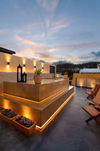 a balcony of a house with lights on it at Casa Rufina Oaxaca Centro - Adults Only in Oaxaca City