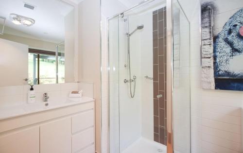 a bathroom with a shower and a sink at Crystalbrook Cottage in Porepunkah