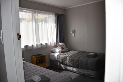 Ένα ή περισσότερα κρεβάτια σε δωμάτιο στο Roxburgh Motels