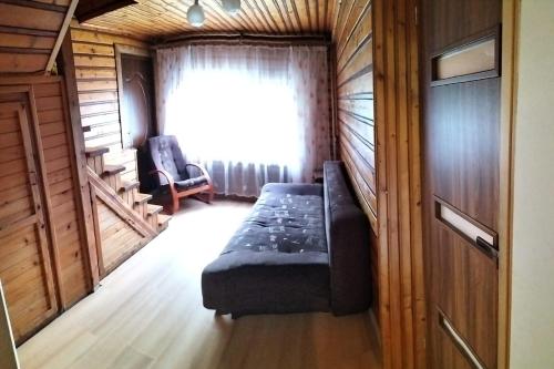 a room with a bed and a window in a train at "Dom Pod Grzybkiem" in Krościenko