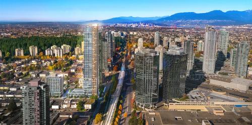 an aerial view of a city with tall buildings at Pacific Sweet Place @Metro in Burnaby