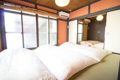 Cama o camas de una habitación en SAMURAI HOUSE Yokohama