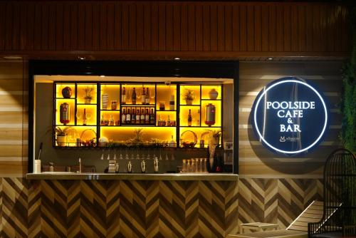 a bar with a sign that saysprovide cafe at bat at The Marison Hotel in Legazpi
