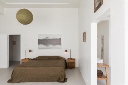 En eller flere senge i et værelse på Villa Ohaki Surf