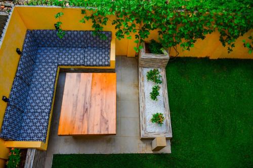 an overhead view of a garden with a wooden door at Woodnest Saayoo Resort in Negombo
