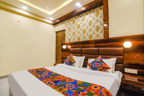 a bedroom with two beds in a room at FabHotel Icon in Patna