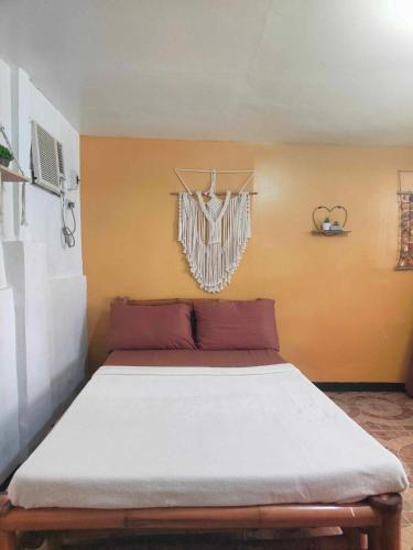 a large bed in a room with at Beach Front Calatagan Apartelle in Calatagan