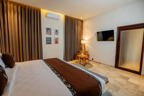Postel nebo postele na pokoji v ubytování Oma Ubud