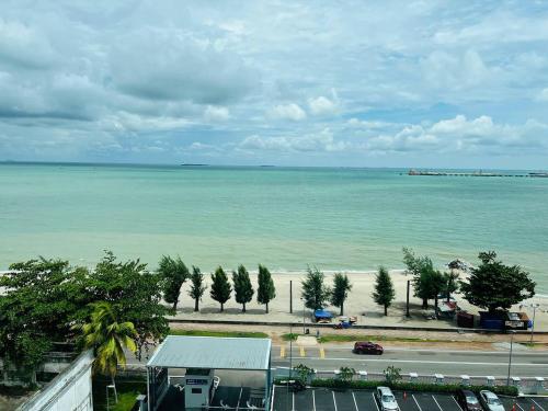 a view of the beach and the ocean at Mutiara Melaka Beach Resort by Glex in Tangga Batu