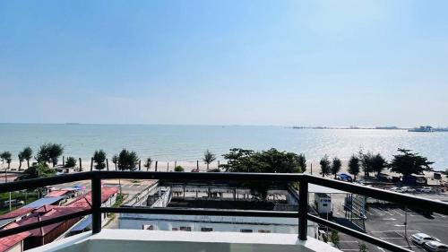a view of the ocean from a balcony at Mutiara Melaka Beach Resort by Glex in Tangga Batu