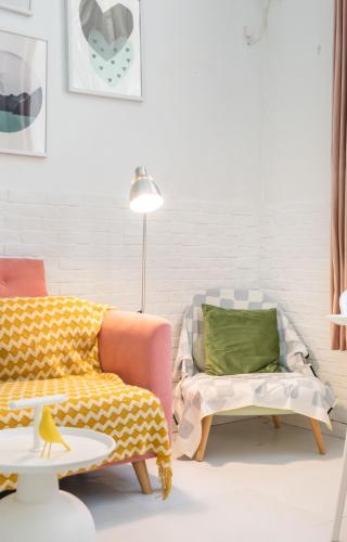 a living room with a couch and a chair at Hills &XING 1771 Homestay near Line1&2&13 and Shanghai People's Square in Shanghai