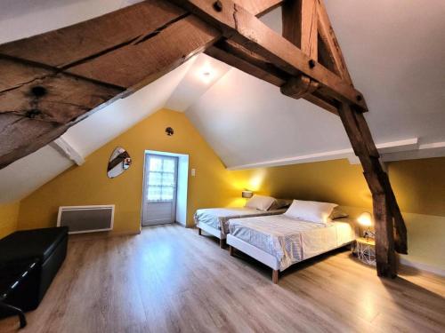 Ένα ή περισσότερα κρεβάτια σε δωμάτιο στο Gîte de France Les 7 sources 3 épis - Gîte de France 4 personnes MAE-9154