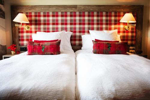 Ein Bett oder Betten in einem Zimmer der Unterkunft Hotel Bristol Verbier