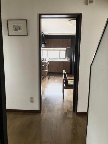 a view of a living room and a dining room at Maison Petit Lapin メゾンプチラパン in Karuizawa