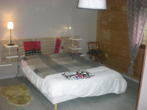 a bedroom with a large bed in a room at Chalet belle vue montagne proche Valmorel 86009 in Valmorel