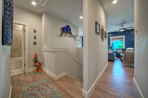 a hallway of a home with a living room at Rock N Reel by AvantStay Old Town Location in Port Aransas