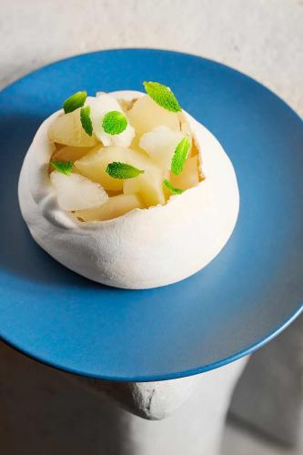 a dessert on a blue plate on a table at The Jay, Autograph Collection in San Francisco