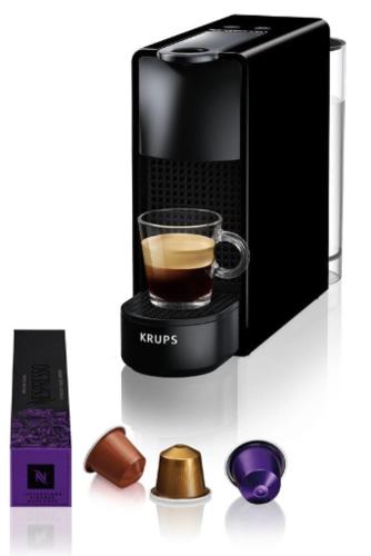 a coffee maker with a cup of coffee and other items at Guesthouse at the Amstel river with 2BR 2BA and garden in Amstelveen