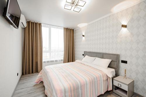 En eller flere senge i et værelse på Modern Escape in Chisinau