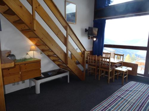 Photo de la galerie de l'établissement Résidence Tournavelles - Appartement 2 pièces 7 personnes en duplex, au pied des pistes et des commerces, proche de l'ESF et de la garderie dans le villa MAE-1875, à Arc 1800