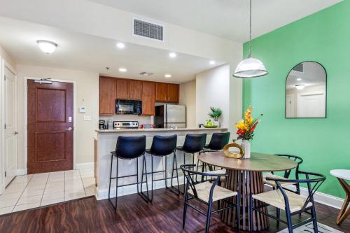 a kitchen and dining room with a table and chairs at Spacious Modern Condos near French Quarter in New Orleans