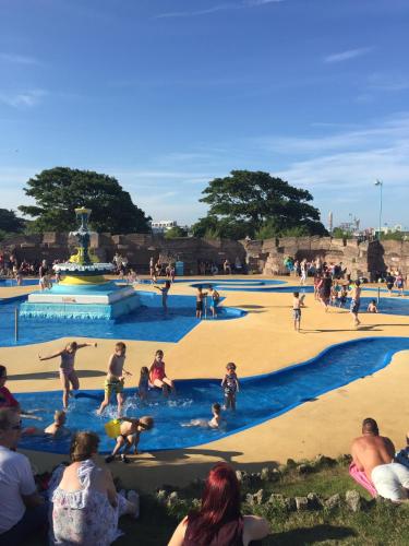 a group of people playing in a water park at The Homestar in Skegness